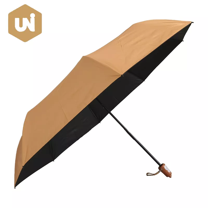 Regenschirm mit Tierkopfgriff und schwarzer Beschichtung